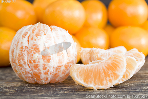 Image of juicy fresh slices of ripe and sweet oranges on the table