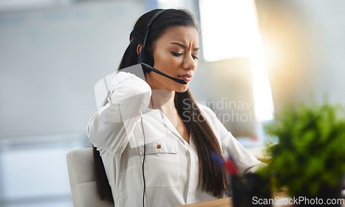 Image of Stress, customer service or woman in call center with back pain injury while working in telecom help desk. Accident, injured agent or tired sales girl with joint pain emergency, fatigue and burnout