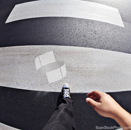 Image of Pov, shoes and man in a road at a pedestrian crossing for weekend, travel and fun in a city. Above, feet and walking male outdoors for fun, walk and commute or solo travelling in town in the morning