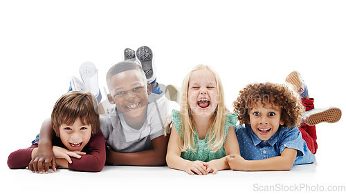 Image of Diversity, portrait of happy children and smiling together in a white background. Happiness or excited, group of friends and multiracial kids and faces have fun, laugh and lay on a isolated studio