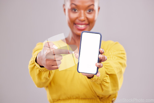 Image of Phone screen, pointing and portrait of woman isolated on studio background, mobile app and advertising mockup. African person or online user on cellphone mock up, website space or social media design