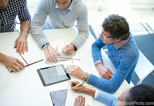 Image of Hands, group and tablet in top view for teamwork, business people or plan strategy together in workplace. Team building, touchscreen or analysis for idea, brainstorming or problem solving in office