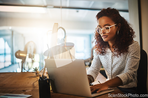 Image of Business woman, laptop and typing in office for strategy, planning schedule or think at desk. Female content manager, seo expert or reading on web, app or social network communication with creativity