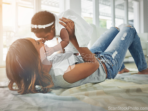 Image of Babies, young mother and daughter on floor with love, fun and happiness playing together in living room. Smile, black woman and baby in bonding embrace, quality time for parent and newborn in home.