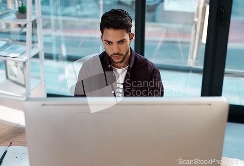 Image of Computer, business and a serious man working at a desk while online for research work on website. Male entrepreneur person with focus and internet connection for banner project or reading email