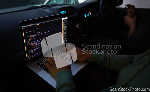 Image of Hacker, code and laptop with person in car for ransomware, cyber security and phishing. Coding, technology and crime with hands of programmer in vehicle for fraud, network system and data at night