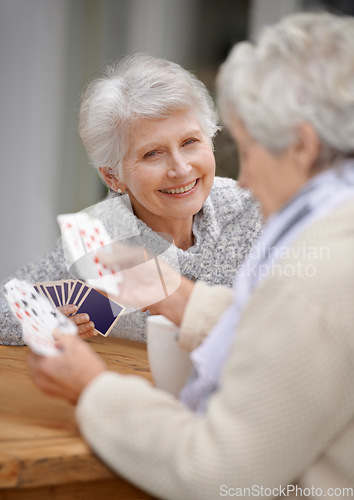 Image of Happy, game and portrait of old people playing cards for happiness and enjoyment in a nursing home. Smile, hobby and content senior women together for poker, card games and relaxing in retirement