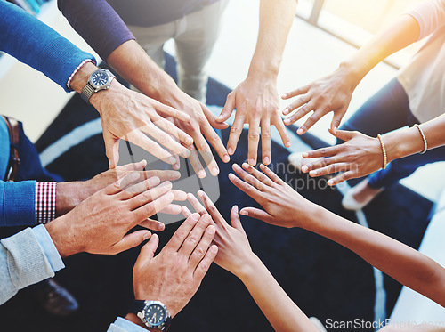 Image of Business staff, hands together and office worker group with support, motivation and solidarity goal. Above, hand in and success of teamwork and people with workplace community and achievement