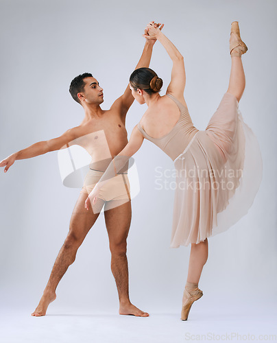 Image of .Ballet dancing couple, studio and holding hands for balance, finesse and art movement for beauty in class. Young dancer team, performance or man with woman in class for fitness, teamwork and focus.