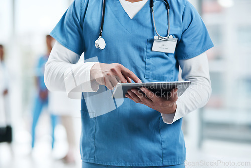 Image of Medical, doctor hands and tablet with a man in a clinic reading healthcare and data at hospital. Employee, nurse and male person typing with digital and health results on technology with research