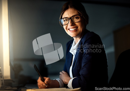 Image of Portrait, businesswoman and writing at night or glasses or smile and pc in formal office. Corporate, dark and female worker or professional or manager in the evening and company or emails on computer