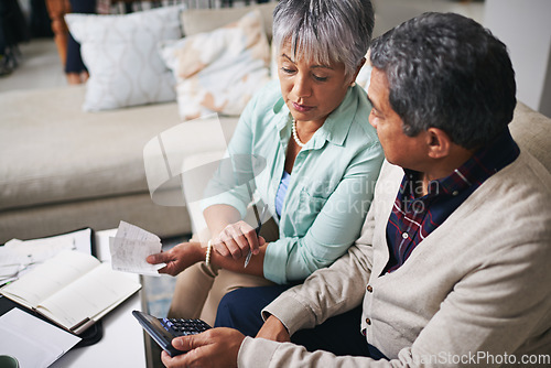 Image of Elderly couple, finance budget and life insurance discussion with banking details and bills. Retirement fund, senior people and communication in a home living room with paperwork and contract