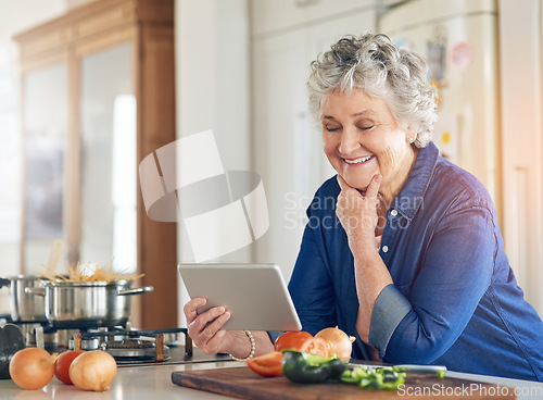 Image of Tablet, cooking vegetables or happy old woman in kitchen while online for learning on recipe blog at home. Smile, healthy food or senior person on digital app to search for a vegan diet on website