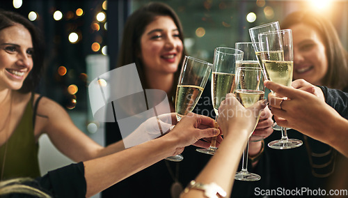 Image of Toast, party and champagne with friends at restaurant for celebration, wine and social event. Happy, diversity and luxury with group of people drinking together for fine dining, cheers and free time