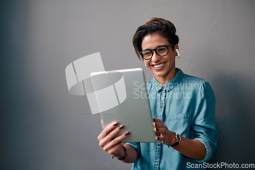 Image of Tablet, music and happy woman or student isolated on gray background for university e learning, online streaming and video. Young person on digital technology, listening to audio and electronics app