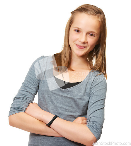 Image of Young teen, portrait and arms crossed in a studio with a smile and youth confidence. White background, female teenager and preteen person with casual fashion and style with happiness of model