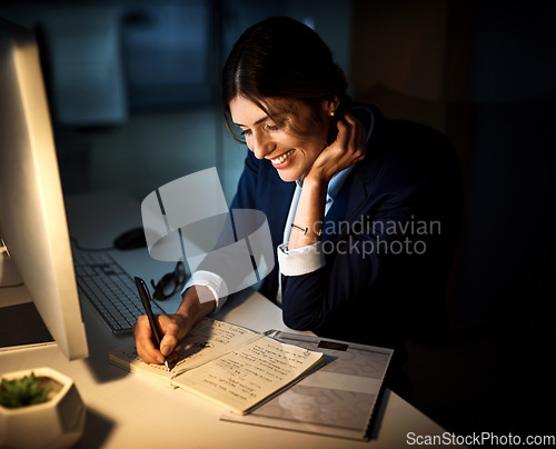 Image of Book, smile and businesswoman or writing at night or planning and pc in an office. Corporate, dark and female worker or project manager in the evening or company note and dedicated on computer