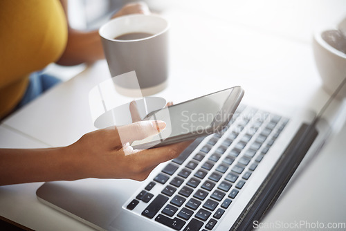 Image of Woman, hands and phone at a laptop for work networking and employee typing. Female worker, table and social network app with mobile communication and text for professional and web connection