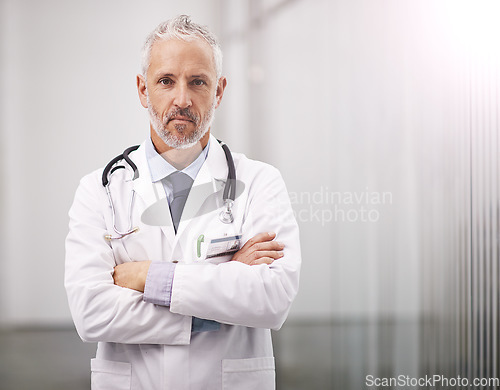 Image of Doctor, healthcare and portrait of a serious man in a hospital with mockup space for health insurance. Professional male medical worker with a stethoscope for a consultation, healing and wellness