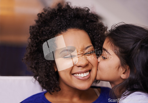 Image of Kiss, mother and girl with love, bonding and quality time with happiness, home and loving. Family, parent or mama with daughter, female child and kid kissing mom, cheerful and care in the living room