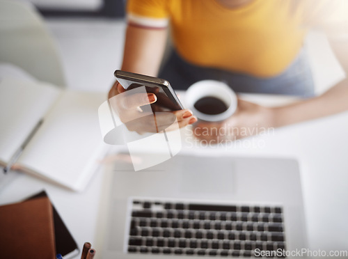 Image of Hands, searching on smartphone with laptop, coffee and work in home office or shopping, browsing and mobile communication. Closeup, woman and social media, internet or online, work or ecommerce