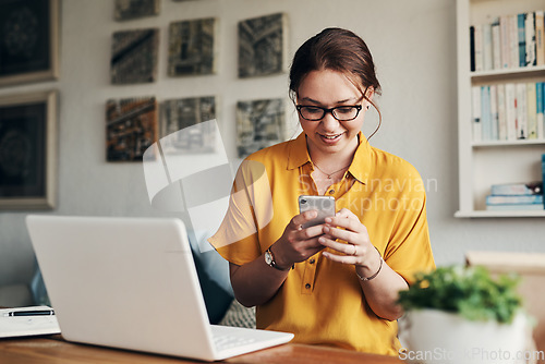 Image of Phone, laptop and smile with woman in home office for networking, social media and remote worker. Communication, contact and internet with female freelancer for technology, blog and email planning