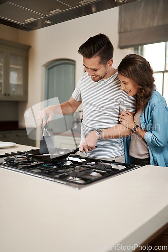 Image of Love, breakfast and cooking with couple in kitchen and hugging for food, morning and happiness. Smile, care and nutrition with man and woman eating at home for happy, health and hungry together