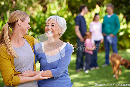 Image of Family, mother and adult daughter hug outdoor, spending quality time in garden together with happiness and care. Happy women are content in relationship with love, laughter and carefree in nature