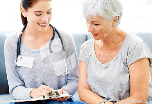 Image of Health, checklist and senior woman care with nurse for insurance and medical consultation. Elderly female patient, healthcare worker and smile in a hospital and clinic with medic paperwork and help