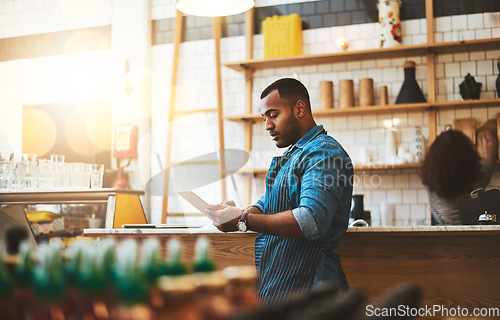 Image of Focus, tablet and manager with man in cafe for online, entrepreneurship and startup. Retail, technology and food industry with small business owner in restaurant for barista, store and coffee shop