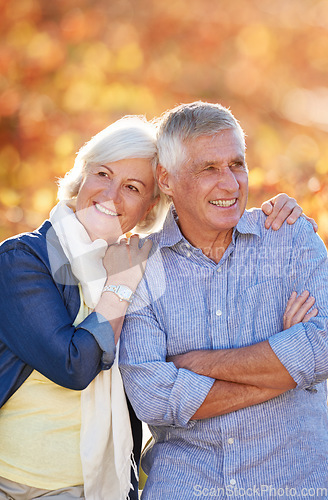 Image of Senior couple, nature and thinking of future together in autumn, park or vineyard or happy, marriage in retirement or relax, love or happiness. Elderly people, smiling outside in fall countryside