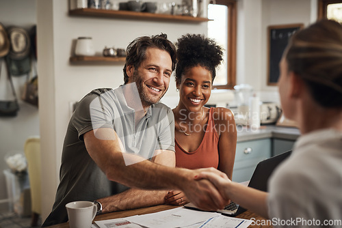 Image of Love, handshake and couple with a financial advisor, consultation and discussion for investments. Partners, man and woman with a consultant, home and conversation for advice, help and shaking hands