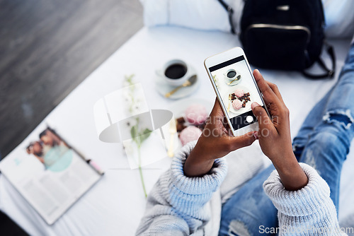 Image of Black woman hands, social media and photo for food blog with cake on hotel bed. Top, female person and screen of a freelance blogger with dessert, technology and vlog with entrepreneur in room