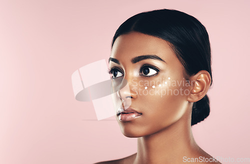 Image of Thinking, skincare and beauty of woman with cream in studio isolated on pink background mockup space. Dermatology, creme cosmetics and Indian female model with moisturizer lotion for healthy skin.