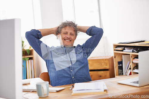 Image of Mature, business man and relax in office with a smile from work target and goal success. Tech break, happy and businessman feeling rest and confident from company and creative writer job