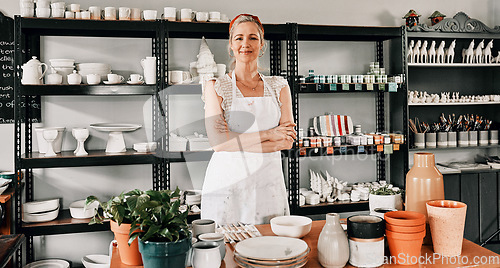 Image of Happy woman, portrait and pottery with arms crossed in small business confidence for crafting in retail store. Confident female person, ceramic designer or owner smiling for craft or creative startup