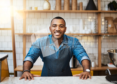 Image of Coffee shop, counter and portrait of black man in restaurant for service, working and welcome in cafe. Small business owner, barista startup and happy male waiter smile in cafeteria ready to serve