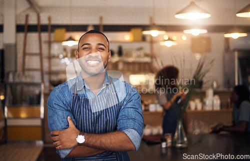 Image of Coffee shop, crossed arms and portrait of black man in restaurant for service, working and happy in cafe. Small business owner, bistro startup and confident male waiter in cafeteria ready to serve