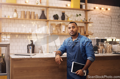 Image of Waiter, tablet and portrait of man in cafe for online, entrepreneurship and startup. African, technology and food industry with small business owner in restaurant for barista, manager and coffee shop