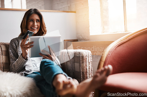 Image of Thinking, tablet and credit card with an ecommerce woman on a sofa in the living room of her home. Online shopping, finance and fintech banking with a young female online customer in her house