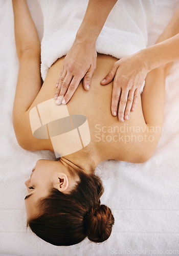 Image of Back, beauty and massage with woman in spa for wellness, luxury and cosmetics treatment from above. Skincare, peace and zen with female customer and hands of therapist for therapy, salon and detox