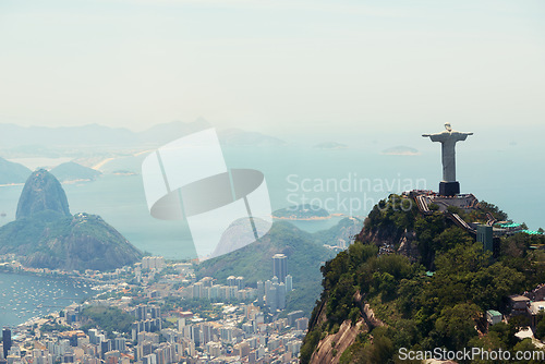 Image of Brazil, monument and aerial of Christ the Redeemer on hill for tourism, sightseeing and travel destination. Traveling, Rio de Janeiro and drone view of statue, sculpture and city landmark on mountain