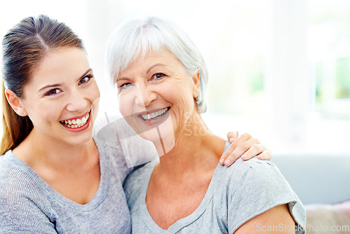 Image of Portrait, happy woman and senior mom on sofa, bonding and happiness together in living room. Smile, mother and daughter on couch, love and weekend quality time to relax with mock up in family home.