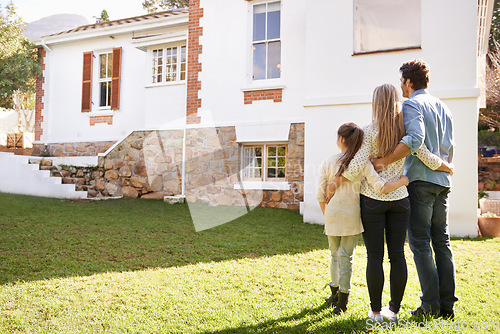 Image of New home, love and family hug for house, real estate building and property purchase, sale or investment. Mortgage, parents and back of mother, father and child hugging for homeowner relocation