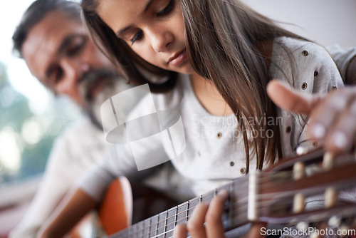 Image of Girl learning to play guitar, grandfather teaching child with music education and help with creativity. Musician, art and mature man helping female kid learn focus and skill on musical instrument