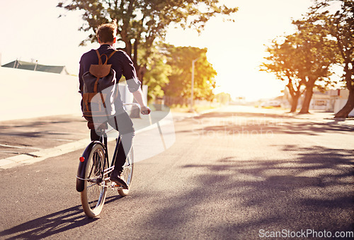 Image of Bicycle, transport and back of man in road with lens flare for exercise, commute and cycling in morning. Travel, city and male cyclist on bike for eco friendly traveling, carbon footprint and journey