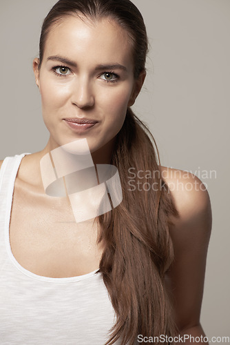 Image of Beauty, portrait of young woman and in studio background. Self care or facial treatment, glamorous cosmetics or dermatology and female model posing for healthcare or skin wellness in backdrop