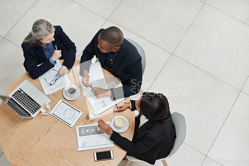 Image of Top view, team and employees planning, collaboration and brainstorming for new project, discussion and partnership. Coworkers, black man and women share ideas, feedback and meeting with development