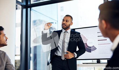 Image of Presentation, meeting and growth with a business man talking to his team in the office boardroom. Training, seminar and finance with a coach teaching staff using a graph display during a workshop