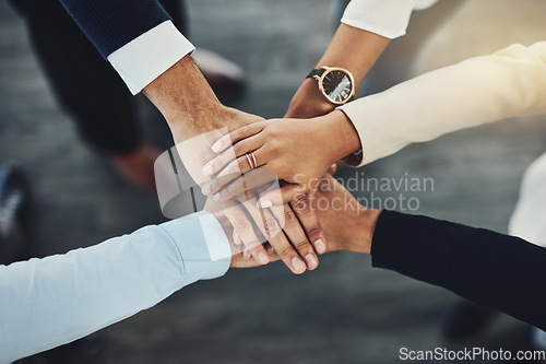 Image of Hands together, business people and solidarity with top view, support and team huddle with collaboration. Group of employees working in office, teamwork and mission with workforce and hand stack